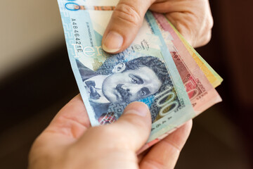 Peru banknotes, Passing money from hand to hand, Finance and business concept, Passing cash to each...