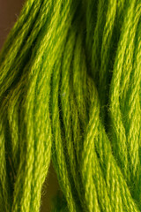 A close up photo of green yarn reminds the viewer of warm seasons and summer breezes.