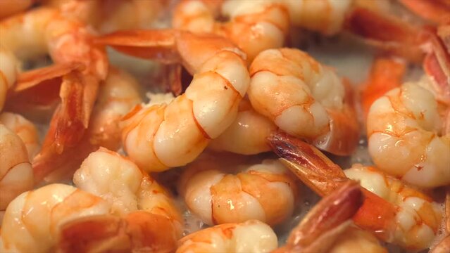 shrimps are cooked in brine with herbs, lemon and hot pepper. shrimps are cooked in sauce