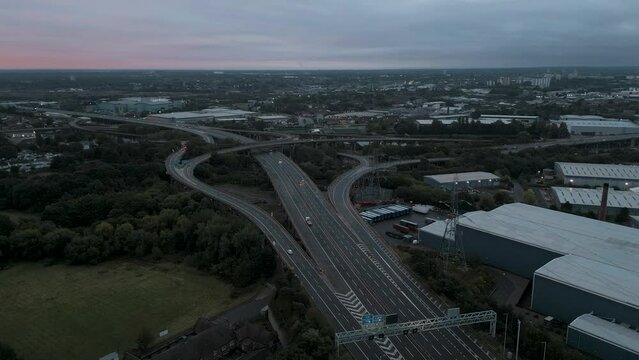 Aerial view of Birmingham spaghetti junction at dawn with moving cars.  