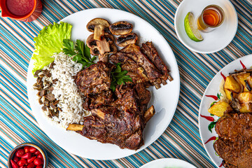 Traditional mexican food. Meat ribs from lamb, beef and pork. Colorful Food Table Celebration Delicious Party Meal Concept. 