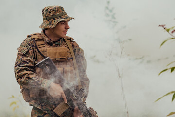 A soldier fights in a warforest area surrounded by fire