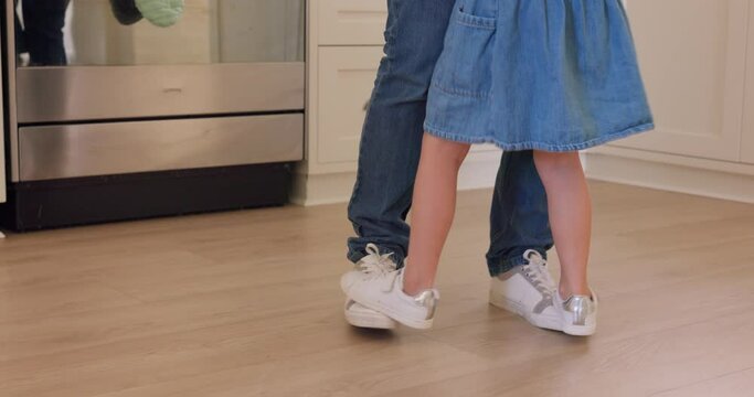 Happy, dance and shoes with father and girl in family home for support, learning and youth. Care, lifestyle or teaching with dad and child dancing on floor together for happiness, crazy or connection