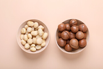 Delicious organic Macadamia nuts on beige background, flat lay