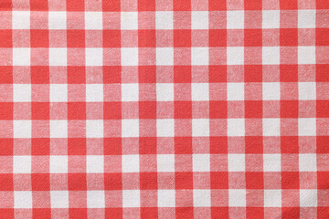 Red checkered tablecloth as background, top view