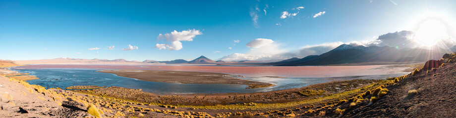 panoramic photo Laguna Colorada Uyuni Bolivia, lagoon, desert and mountains in the background