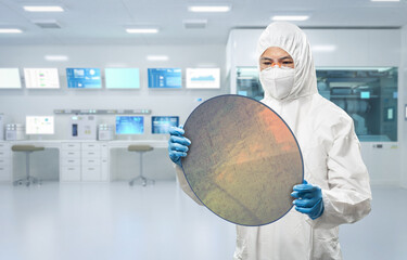 Worker or engineer wears medical protective suit or white coverall suit with silicon wafer - obrazy, fototapety, plakaty