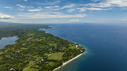 Fototapeta na wymiar Aerial view of coastline of Negros island and blue sea. Seascape: Ocean and blue sky. Philippines.