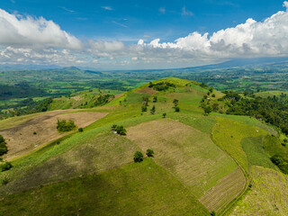 Obraz premium Top view of rice plantations and farmland of farmers in a mountain valley. Negros, Philippines