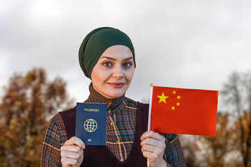 Muslim Woman Holding Passport and Flag of China
