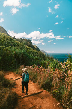 Female Hiker on Tropical Coastline Vertical