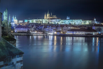 Fototapeta na wymiar Panoramic view over the cityscape of Prague at dramatic dusk, Czech Republic