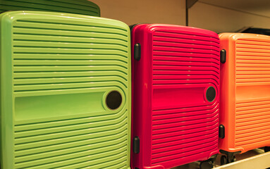Set of stylish light suitcase for travelling. Colorful cases for vacation in the store for sale