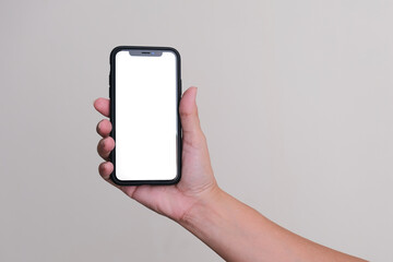 A woman’s hand holding a smartphone.