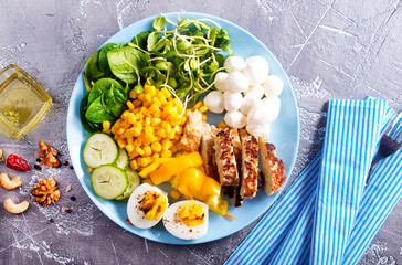 diet salad wih vegetables and fried chicken