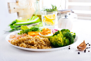 Salad with Prawns and Eggs with vegetables on plate