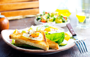 Sandwich with Fried Egg and salad on plate