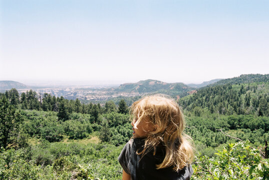 Carefree girl looking at view against clear sky