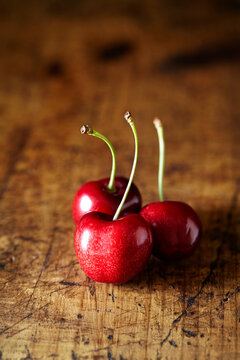 Close-up of cherries on wooden table