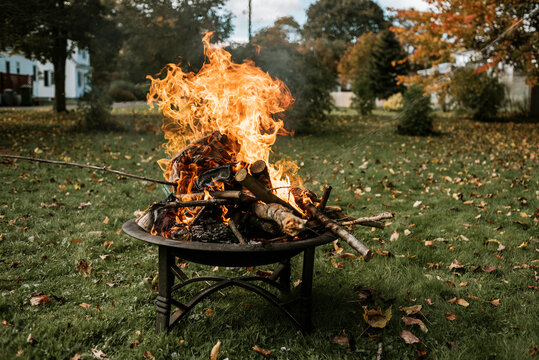 Wood burning in fire pit at yard