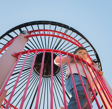 Low angle view of boy standing at observation point