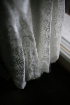 High angle view of wedding dress hanging at home