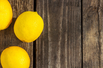 lemon on a wooden board, wooden table, Top view