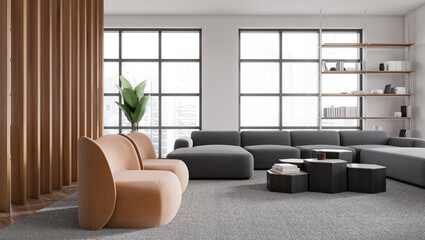 Stylish living room interior with armchairs and couch with shelf near window