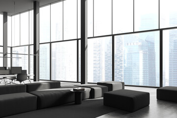 Grey office interior with relaxing zone with workspace near panoramic window
