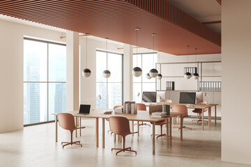 Beige business interior with pc computer and shelf near panoramic window