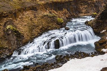 Beautiful long exposure shot of the cascades of Rollutorfufoss waterfall, Skóga river, Laugavegur hiking trail, Iceland