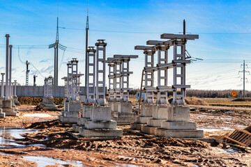 Monolithic reinforced concrete foundation or grillage for the construction of a modern power plant. Powerful columns and grillages at the construction site. Reinforced concrete monolithic structures.