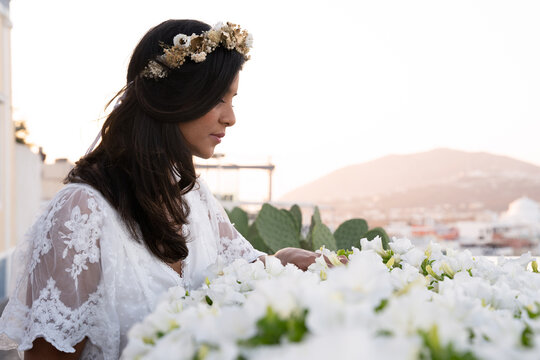 Lady touching flowers