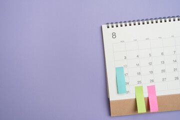 close up of calendar on the violet table background, planning for business meeting or travel...