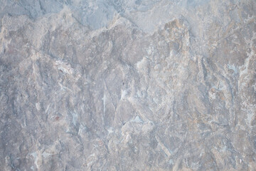 Light gray stone surface, abstract rocky background with cracks