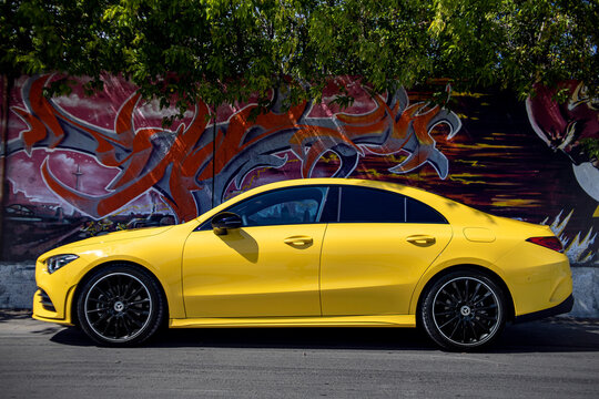 Yellow car on the road Mercedes CLA