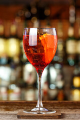 Red drink in a glass with ice