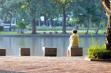 the old woman, senior sitting on a bench in the park