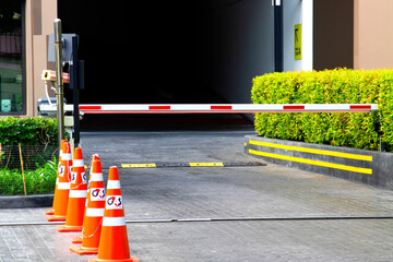 security system for building access - barrier gate stop with toll booth, traffic cones and cctv