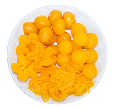 egg yoke fudge balls cooked in syrup isolated