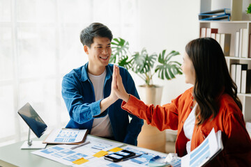 Obraz premium UX developer and ui designer brainstorming about mobile app interface wireframe design with customer breif and color code at office..