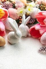 A bouquet of tulips, Easter bunnies and eggs.