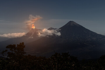 Eruption of volcano Fuego caught at a distance at night