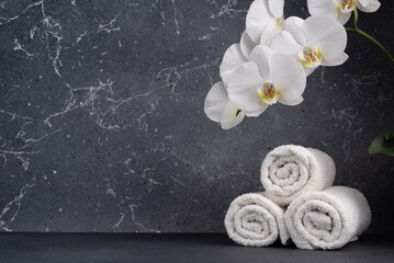 Background with towels and orchid for natural, eco friendly, beauty, bathroom or treatment product
