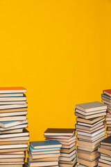 science knowledge reading many books on a yellow background in the library in the office