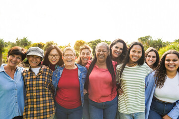 Multi generational women smiling in front of camera - Female multiracial group having fun togheter...