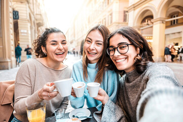 Girls friends group drinking cappuccino at coffee bar - Women people talking and having fun...