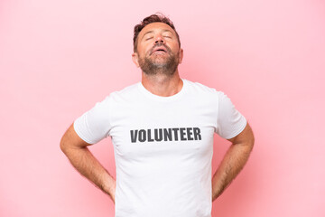 Middle age volunteer man isolated on pink background isolated on pink background suffering from...