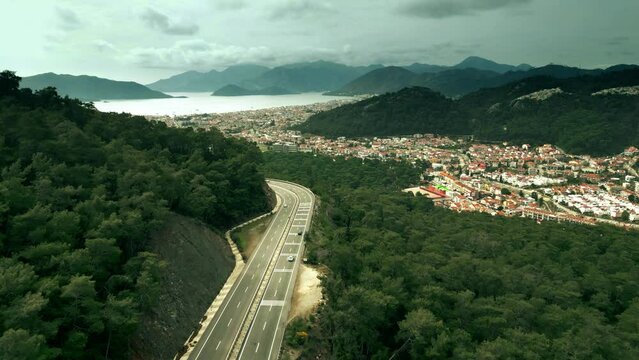 Aerial revealing shot of Marmaris and beautiful coastal area as seen from the highway leading from Mugla. Turkey