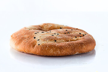 Flatbread with sesame seeds on a white background.
